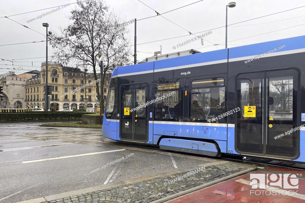 Stock Photo: Subject image Mobility in large cities A tram, streetcar, city traffic runs on Karlsplatz, Stachus in Munich. OEPNV, local public transport, city transport.