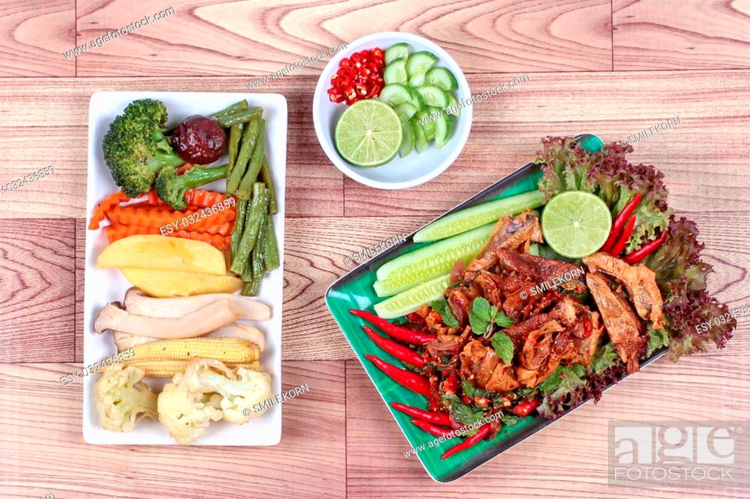 Stock Photo: Spicy and sour mixed herb salad with fried stir taro in tofu sheet and fried mixed vegetables served with side dish are food for Vegetable festival of Chinese.