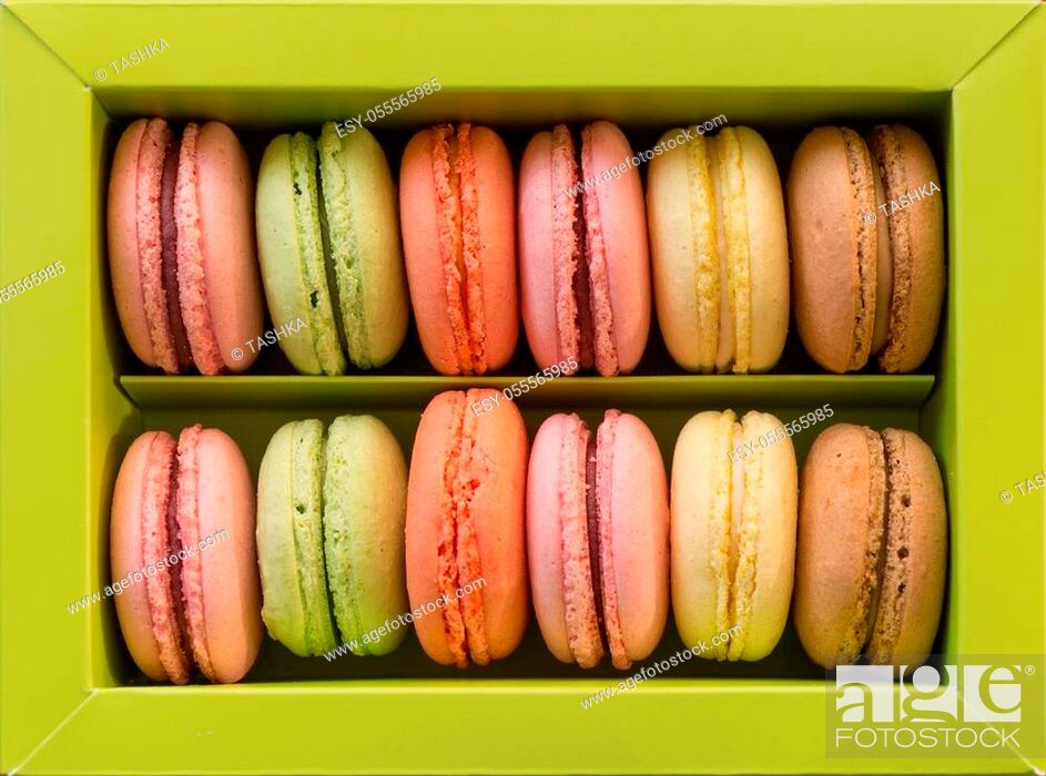 Stock Photo: Green box of colorful macarons assortment.
