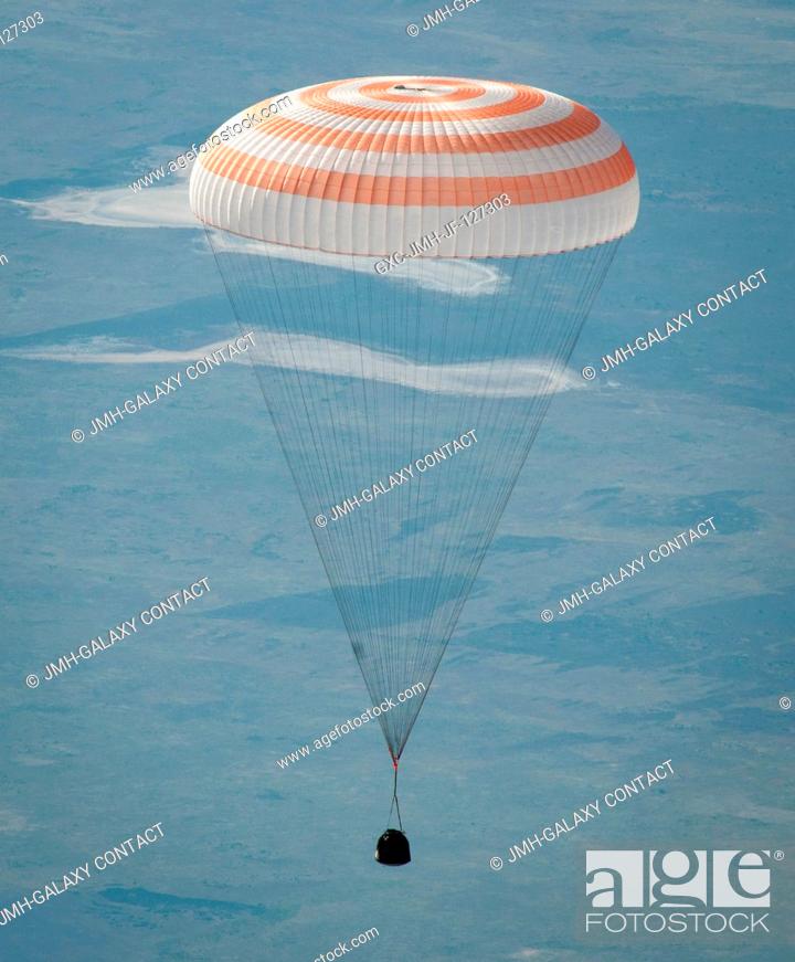 Stock Photo: The Soyuz TMA-20 spacecraft is seen as it glides to a landing with Russian cosmonaut Dmitry Kondratyev, Expedition 27 commander.