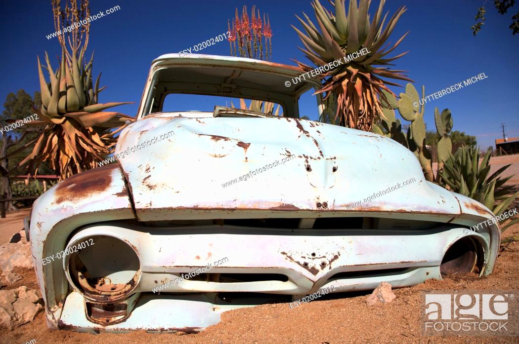 Stock Photo: crashed car in the desert.