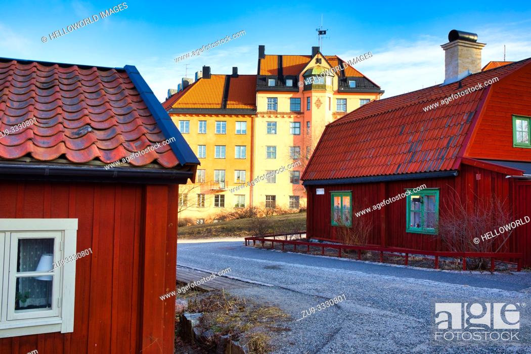Stock Photo: Typical wooden residential houses painted in traditional falun red in the cultural preserve of Vita Bergen (white mountain), Sodermalm, Stockholm, Sweden.