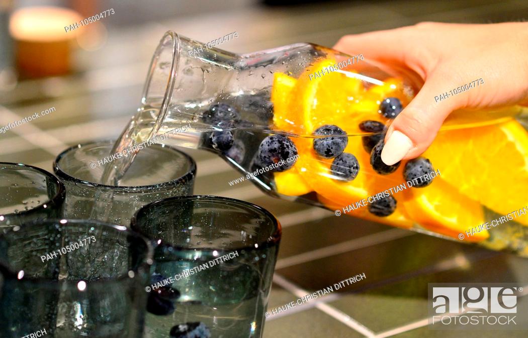 Stock Photo: Flavored drinking water with berries and orange on a table in Hanover (Germany), 20 April 2018. | usage worldwide. - Hannover/Niedersachsen/Germany.