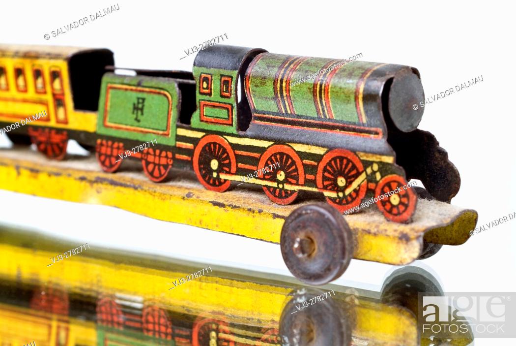 Imagen: vintage, old toy, sheet metal locomotive, studio photography girona, catalonia, spain, .