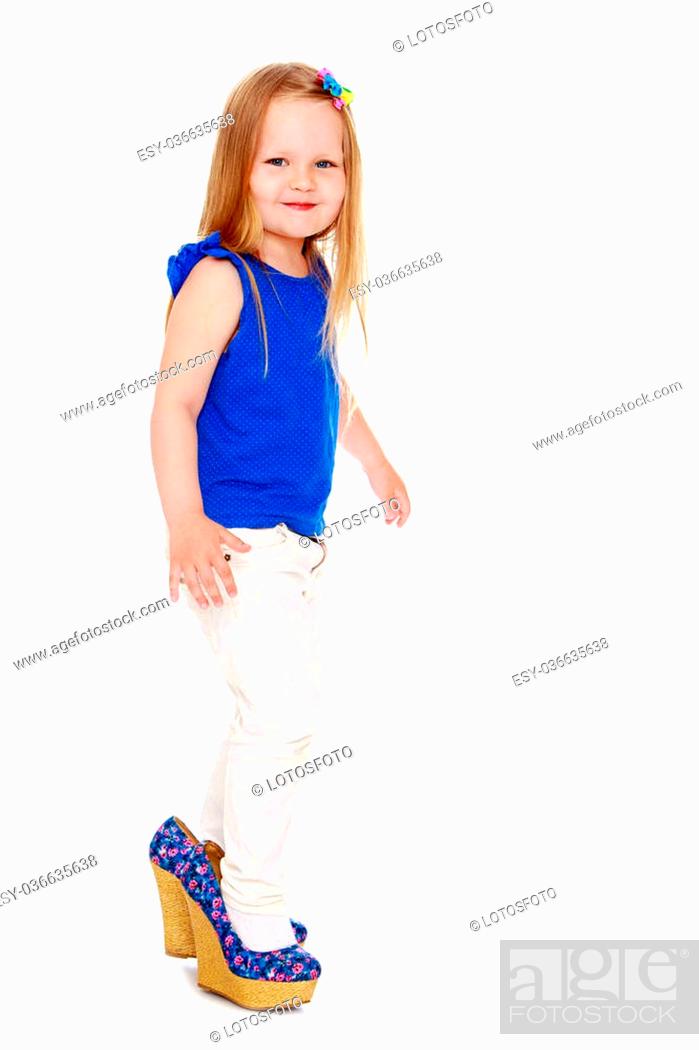 Funny little girl in mom's shoes-Isolated on white background, Stock Photo,  Picture And Low Budget Royalty Free Image. Pic. ESY-036635638 | agefotostock