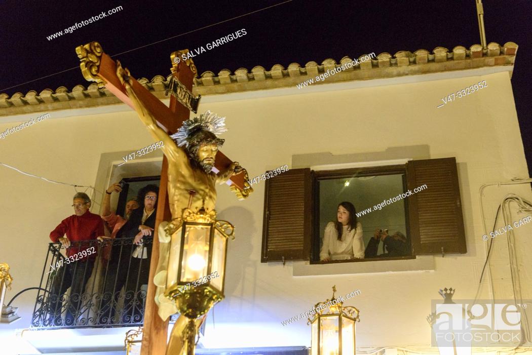Stock Photo: The brothers carry the crucified Christ through the streets of Altea with the Anda (float) on the shoulders, Alicante, Comunitat Valenciana, Spain.