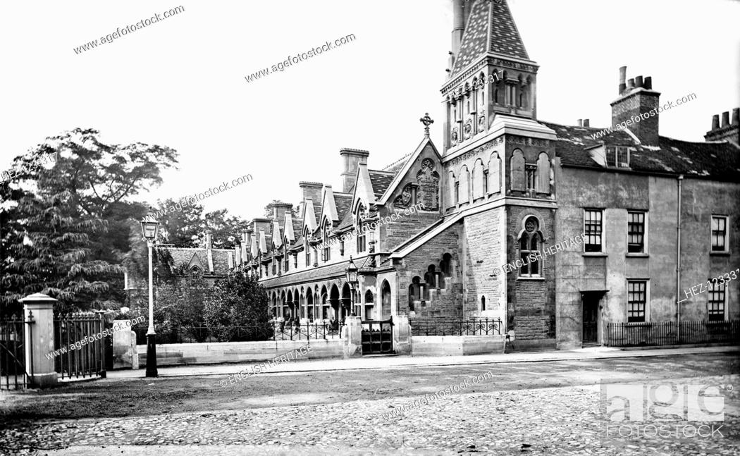 Stock Photo: Powell's Almshouses, Fulham, London, c1860-1922. Powell's Almshouses, an L-shaped block with a tower to the west, founded in 1680 but rebuilt in 1869.