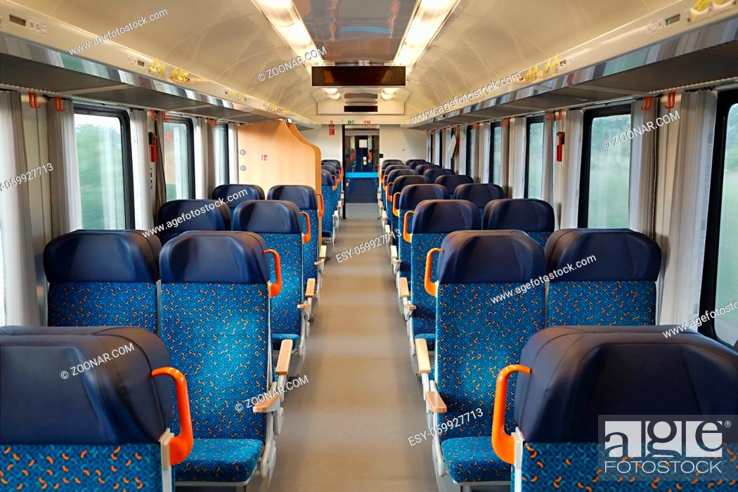 Stock Photo: Interior of a passenger train with empty seats.