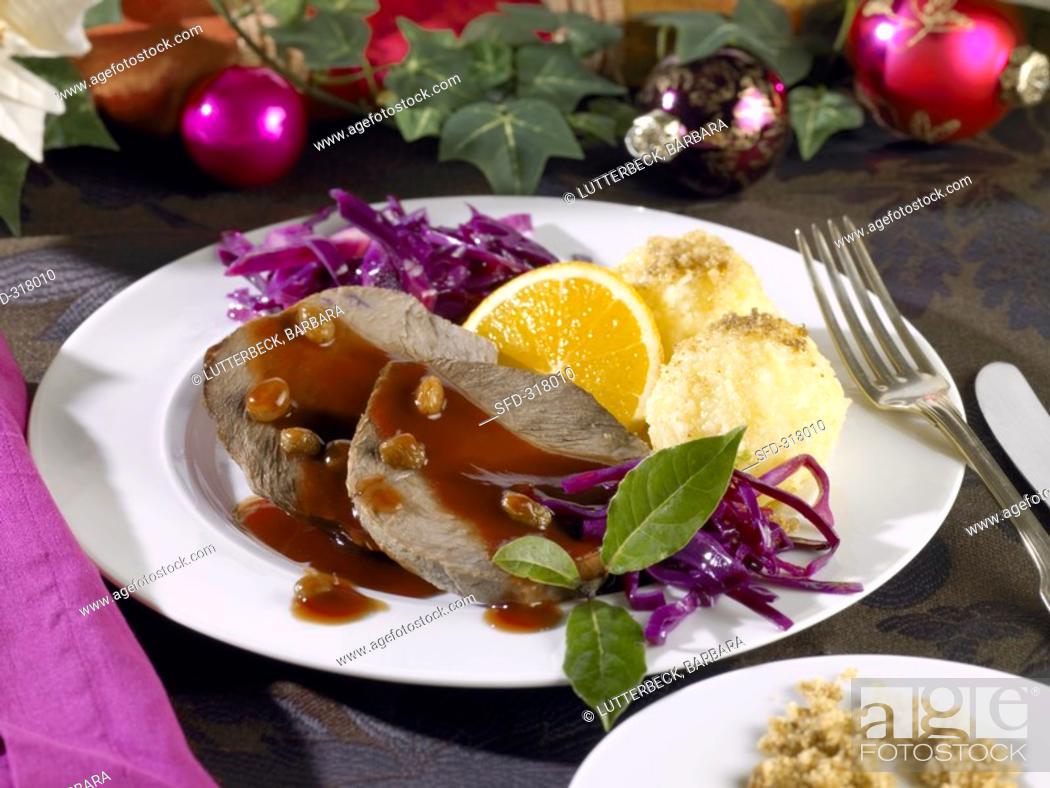 Stock Photo: Roast venison with potato dumplings and red cabbage.