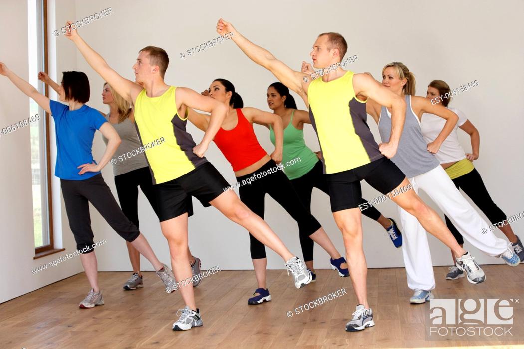 Stock Photo: Group Of People Exercising In Dance Studio.