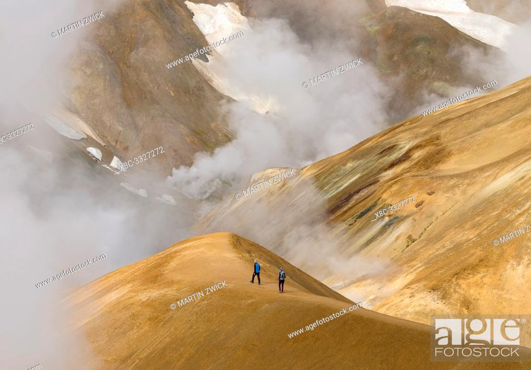 Stock Photo: Hikers in the geothermal area Hveradalir in the mountains Kerlingarfjoell in the highlands of Iceland. Europe, Northern Europe, Iceland, August.
