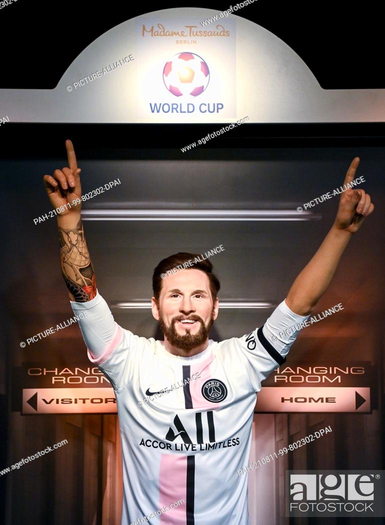 Stock Photo: 11 August 2021, Berlin: The wax figure of footballer Lionel Messi stands at Madame Tussauds Berlinder and wears the jersey of Paris Saint-Germain.