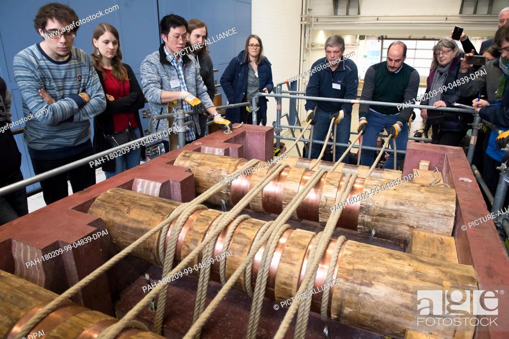 Stock Photo: Uwe Dorka (6-L), line manager of steel and composite construction at the University of Kassel, and visitors standing around a true to the original 1-1 replica.