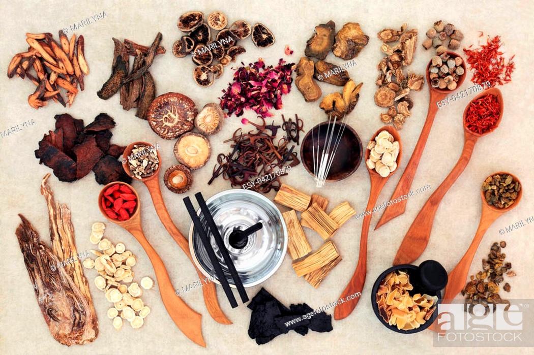 Stock Photo: Chinese herbal medicine with traditional herbs, acupuncture needles, moxa sticks used in moxibustion therapy and mortar with pestle on hemp paper background.