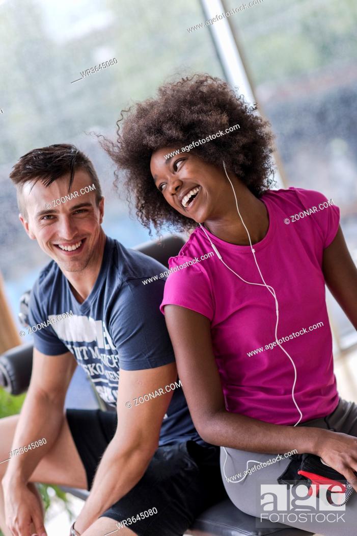 Stock Photo: healthy couple have break at crossfit gym african american woman with afro hairstyle.