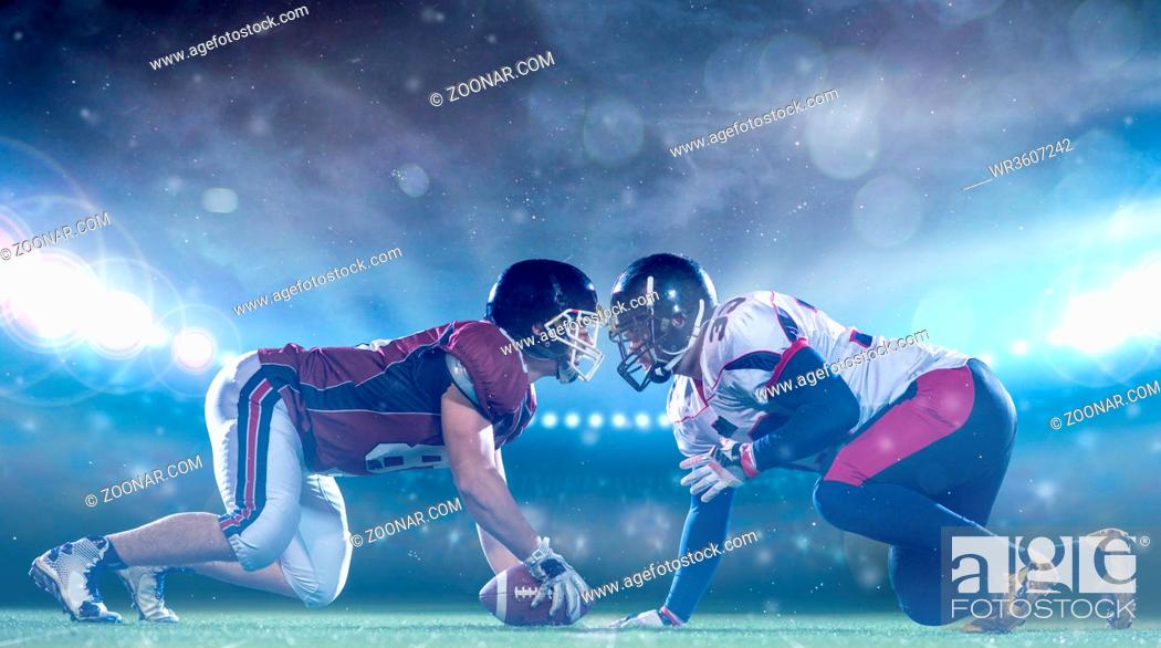 Stock Photo: american football players are ready to start a match on modern field at night.