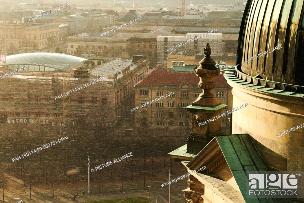 Stock Photo: 14 January 2019, Berlin: The view from the Berlin Cathedral in Berlin Mitte. The wet roofs of the capital reflect the sunlight.