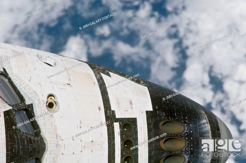 Stock Photo: This close-up view of the nose of space shuttle Discovery was provided by an Expedition 26 crew member during a survey of the approaching STS-133 vehicle prior.