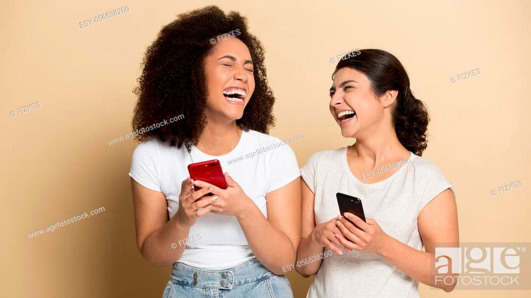 Diverse beautiful girls using phones, laughing out loud at funny video or  joke in social network, Stock Photo, Picture And Low Budget Royalty Free  Image. Pic. ESY-056538260 | agefotostock