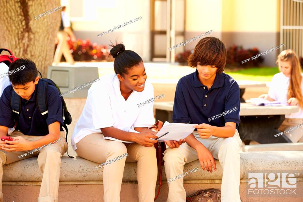 Stock Photo: High School Students Hanging Out On School Campus.