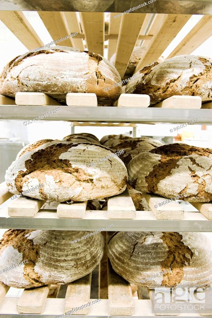 Stock Photo: Some bread in a breadshelf.