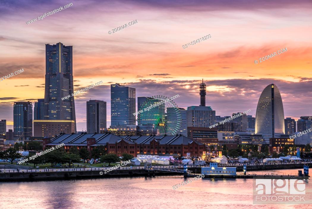 Stock Photo: Cosmo Clock 21 Big Wheel at Cosmo World Theme Park, Landmark Tower and Pacifico Yokohama National Convention Hall overlooking the Red Brick Warehouse and.