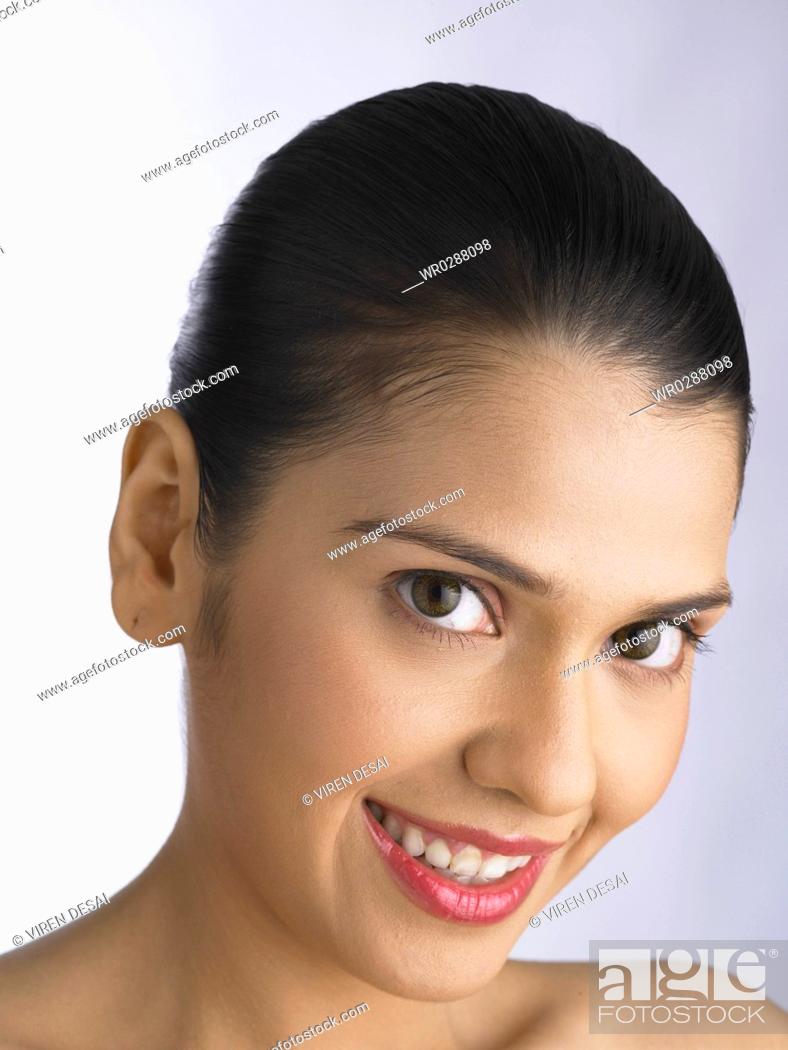 Stock Photo: South Asian Indian woman smiling and looking at camera MR 702.