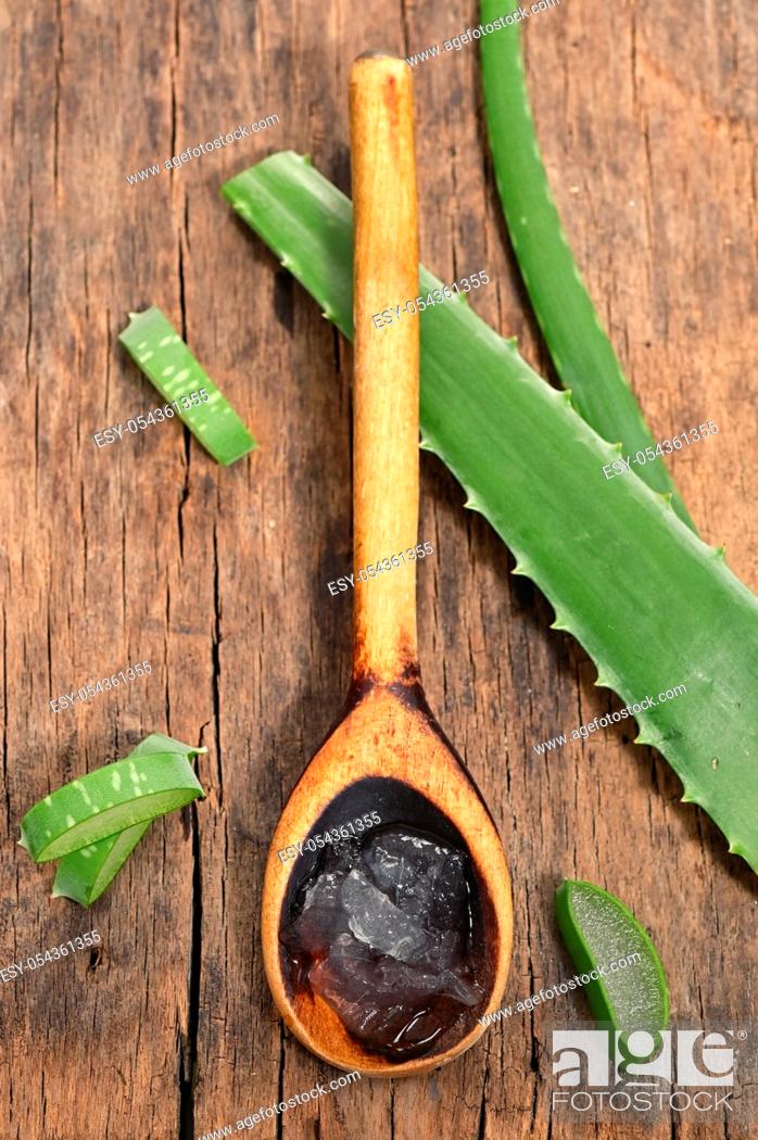 Stock Photo: Aloe Vera Slices On Wooden Table And Spoon With Aloe Gel.