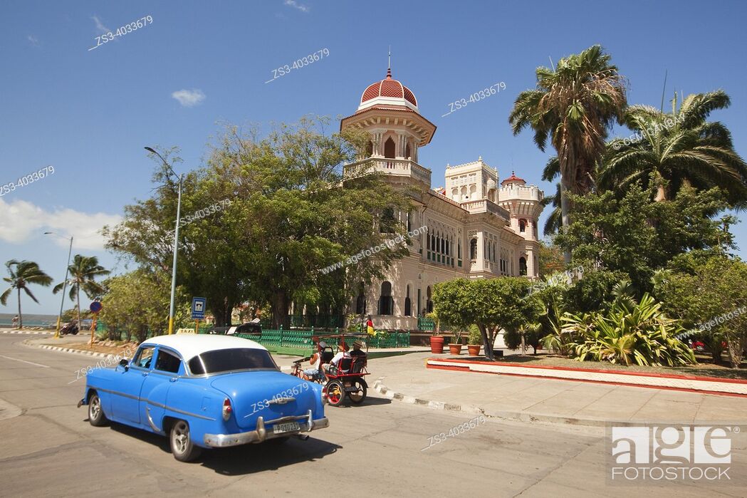 Stock Photo: View of Valle's Palace-Palacio Valle at Punta Gorda district with an old American car in the foreground, Cienfuegos, Cuba, Central America.