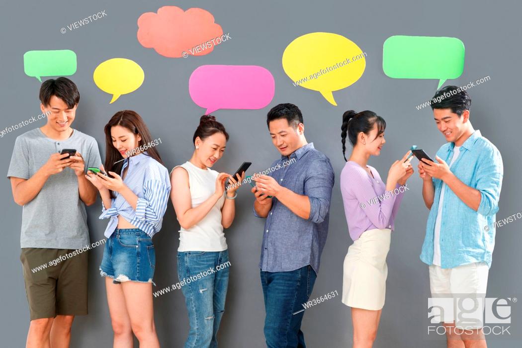 Stock Photo: Happy couples use mobile phone chat software to communicate.