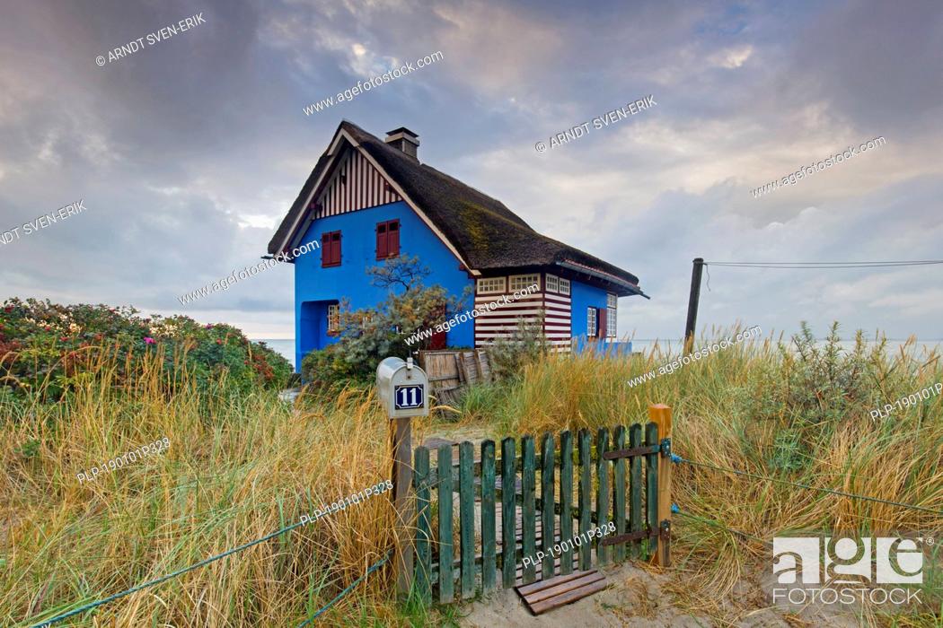 Stock Photo: Blue beach house on the peninsula Graswarder, Heiligenhafen, Schleswig-Holstein, Germany.