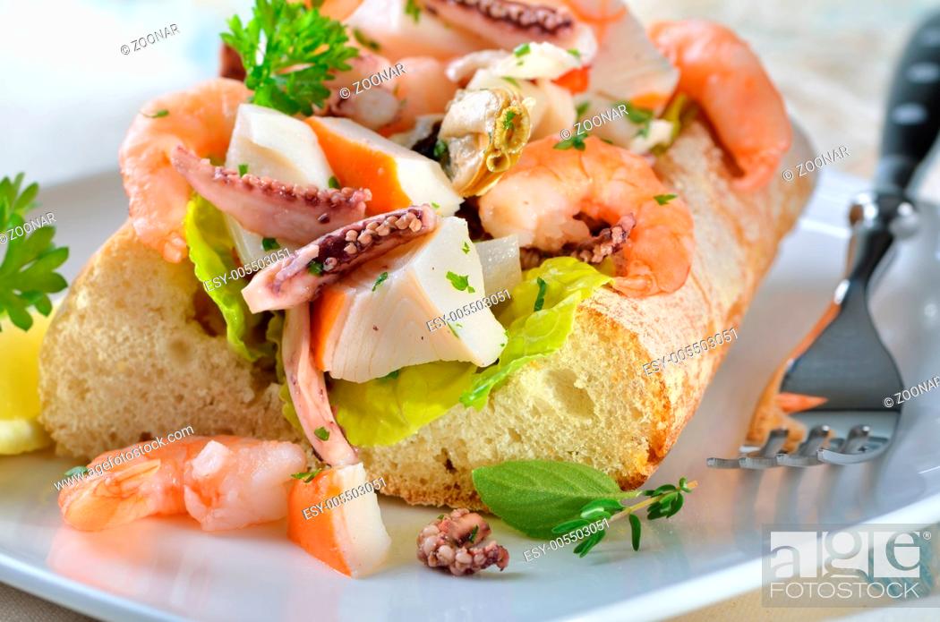 Stock Photo: Seafood salad on bread.