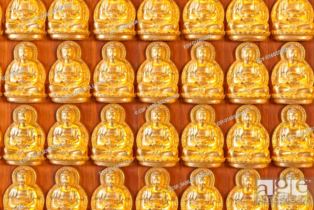 Stock Photo: Hundreds of golden Budhha statues background.
