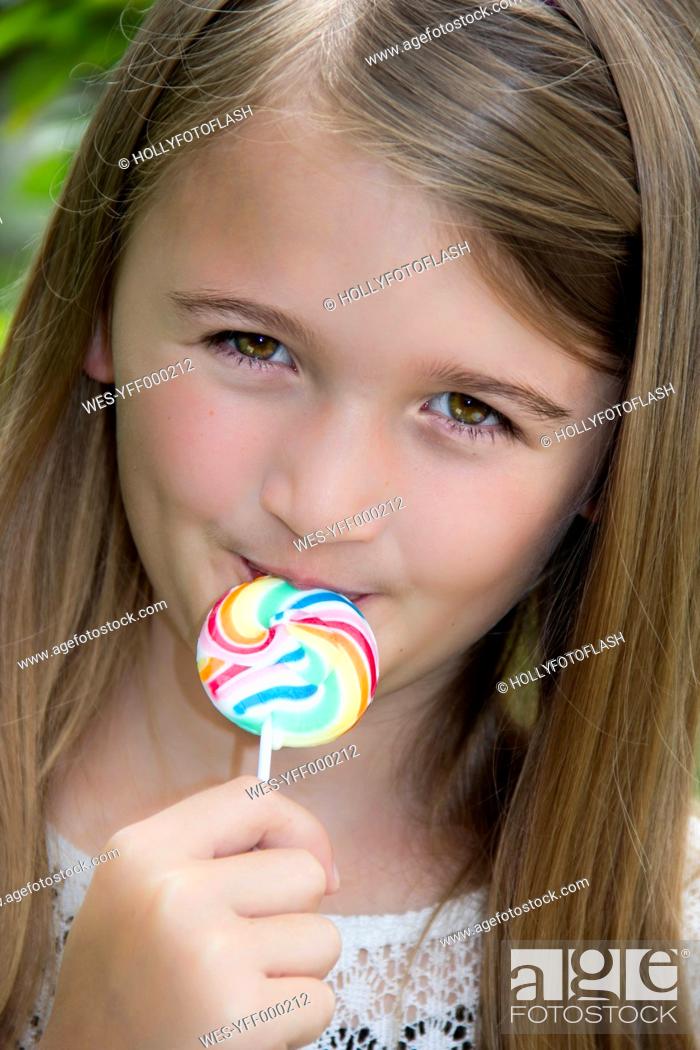 Stock Photo: Portrait of girl with lollipop.