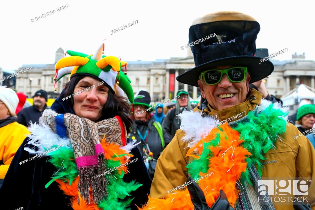 Stock Photo: People celebrates St Patrick's Day in Trafalgar Square. Saint Patrick's Day, or the Feast of Saint Patrick, is a cultural and religious celebration normally.