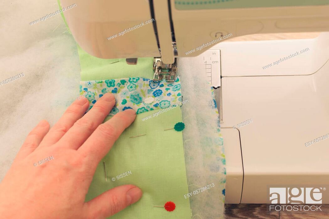 Stock Photo: Patchwork on the sewing machine quilted stages.