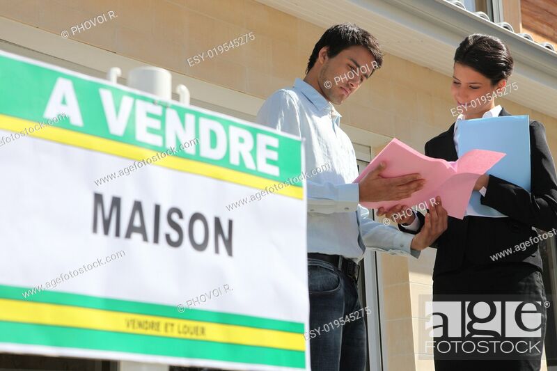 Stock Photo: Agent discussing details with a property vendor.
