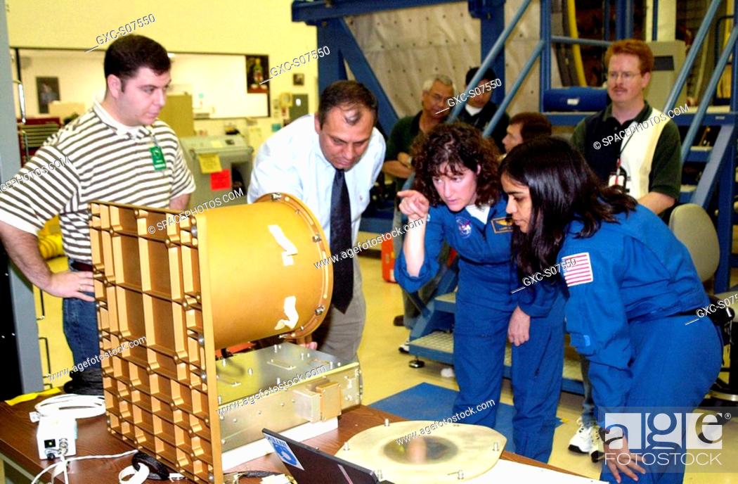 Stock Photo: 12/19/2001 - At SPACEHAB, Cape Canaveral, Fla., members of the STS-107 crew familiarize themselves with experiments and equipment for the mission.