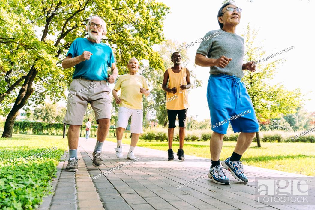 Stock Photo: group of senior friends training at the park. Lifestyle concepts about seniority and third age.