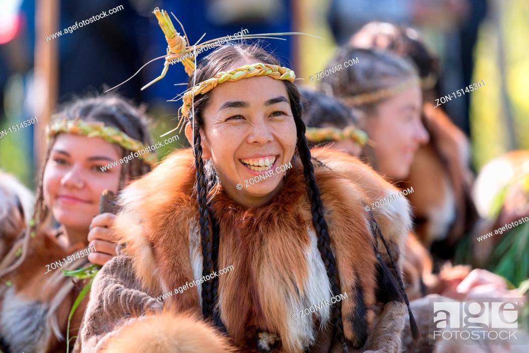 Stock Photo: Portrait expression young woman in clothing indigenous people of Kamchatka Peninsula. Alhalalalay - Itelmens national ritual festival of thanksgiving nature.