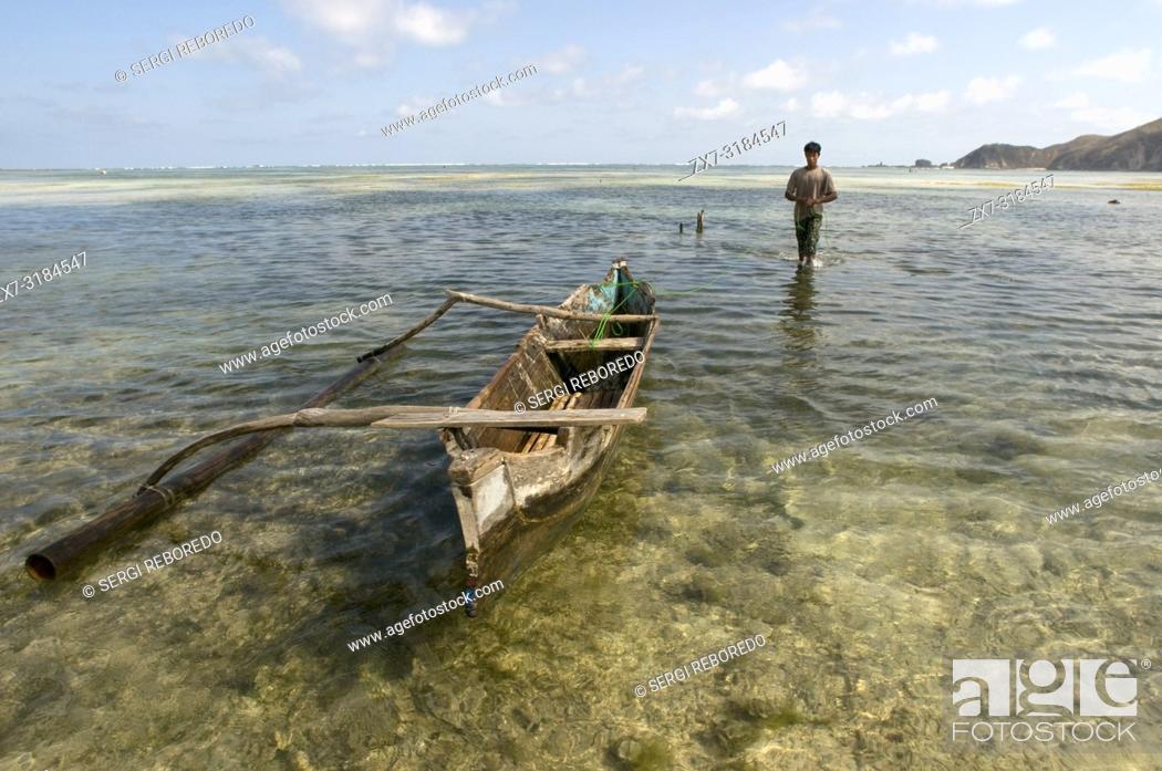 Stock Photo: A boat in Kuta beach, a fishing village south of Lombok Indonesia.