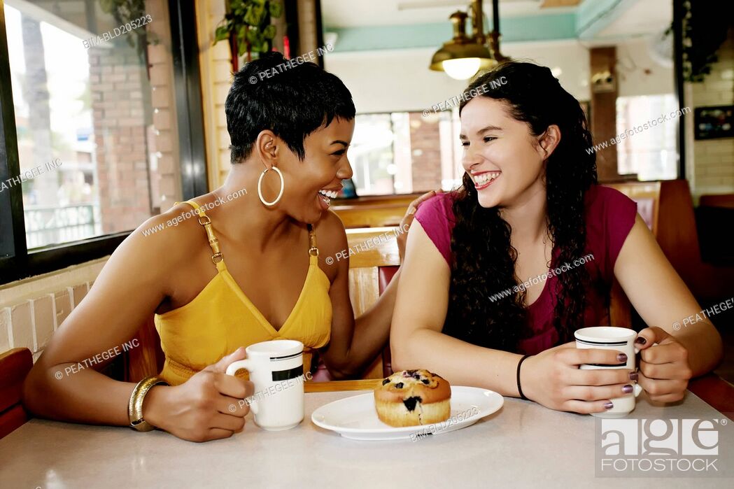 Stock Photo: Women having coffee together in restaurant.