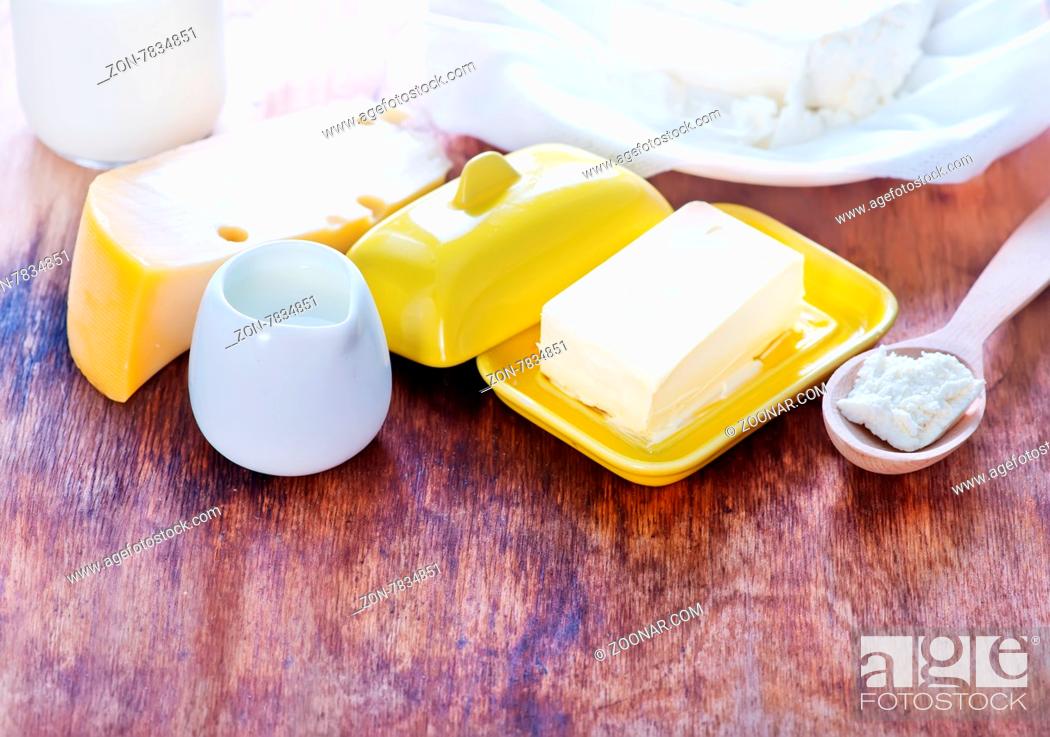 Stock Photo: milk products on the wooden table, cottage and butter.