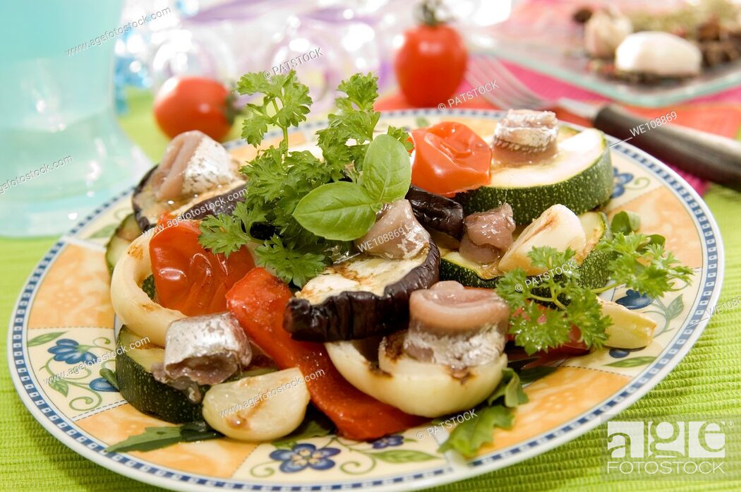 Stock Photo: Grilled herring with vegetables salad.