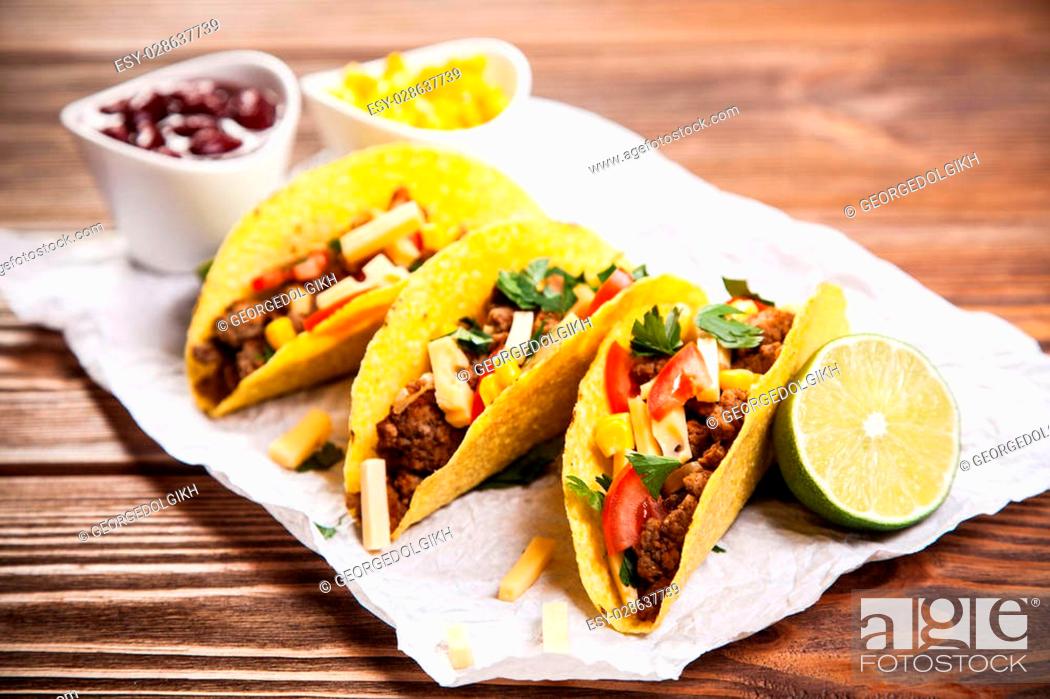 Stock Photo: Mexican food - delicious tacos with ground beef.