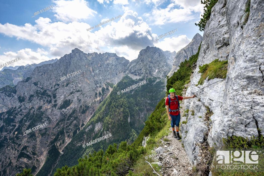 Stock Photo: Young hiker on the Sentiero Carlo Minazio path, Sorapiss circuit, Dolomites, Belluno, Italy, Europe.