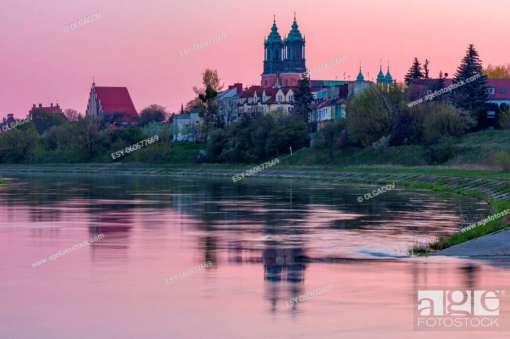 Stock Photo: Poznan Cathedral on the island of Ostrow Tumski and Warta river at pink sunrise, Poznan, Poland.