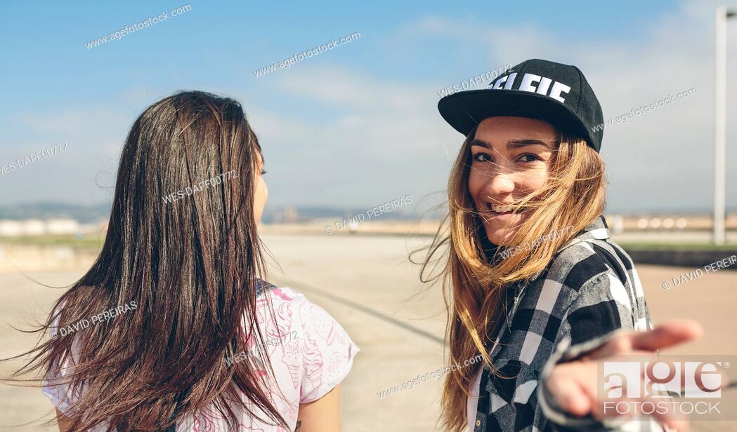 Stock Photo: Two young women on beach promenade.