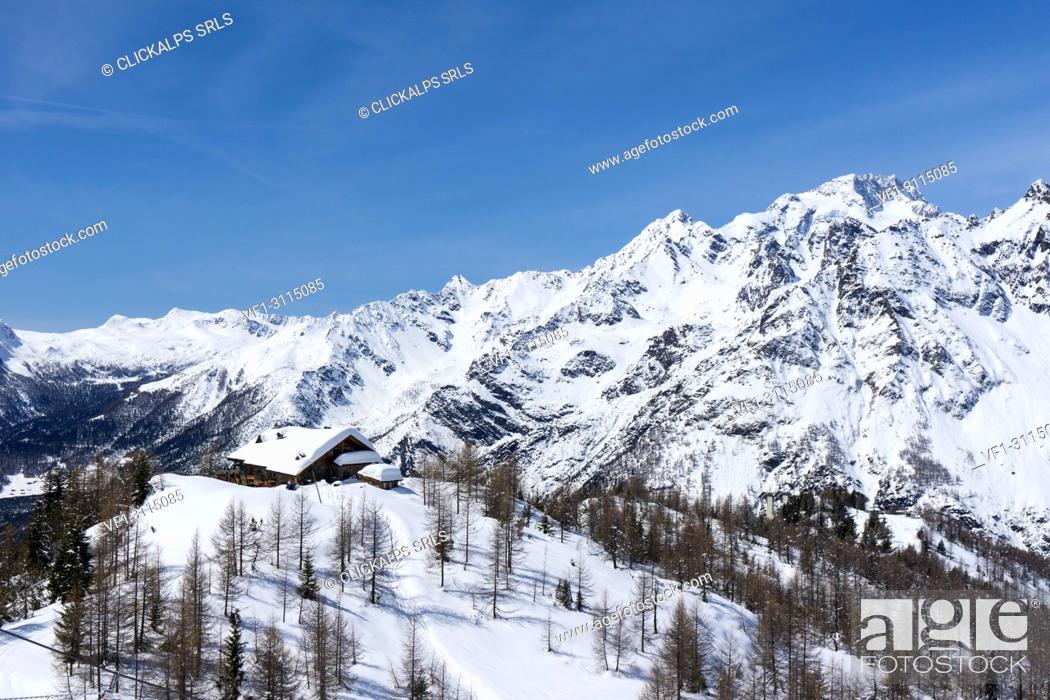 Stock Photo: Motta Refuge with Mount Disgrazia in the background in winter, Valmalenco, Province of Sondrio, Lombardy, Italy.