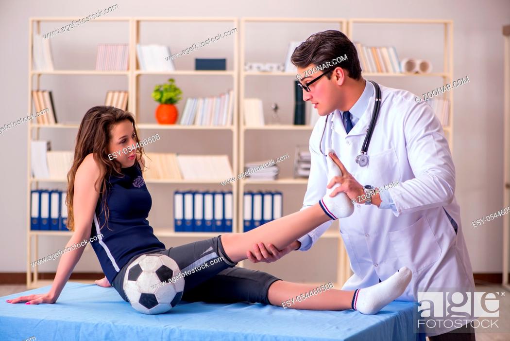 Stock Photo: Man doctor taking care of sports injury.